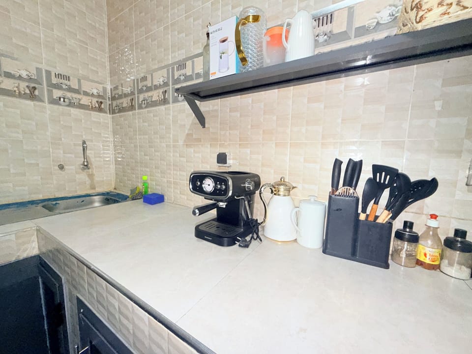 Mini-fridge, paper towels, dining tables