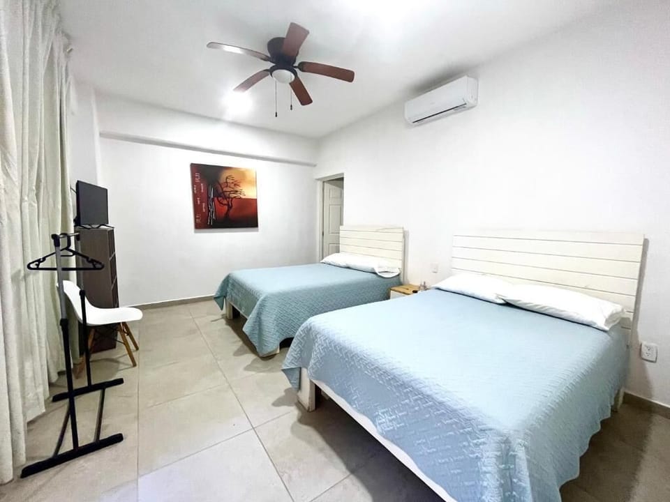 Deluxe Villa, Balcony, Pool View | Desk, laptop workspace, iron/ironing board, cribs/infant beds