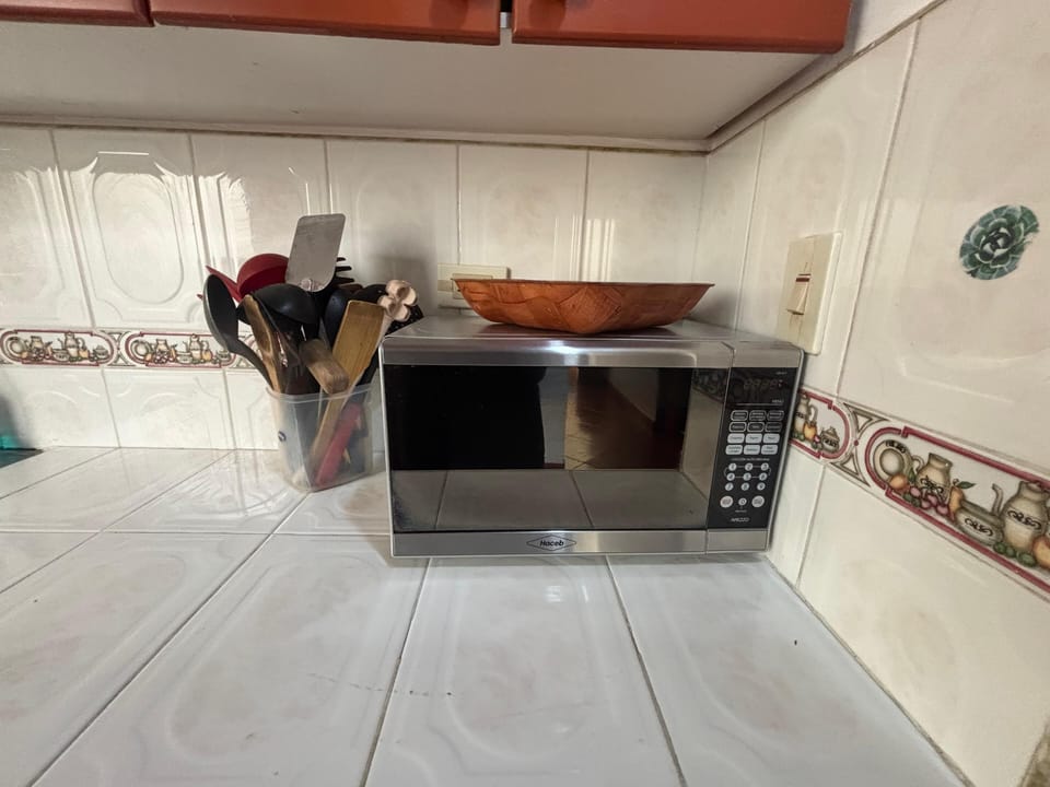 Family Apartment, Partial Lake View | Private kitchenette | Microwave