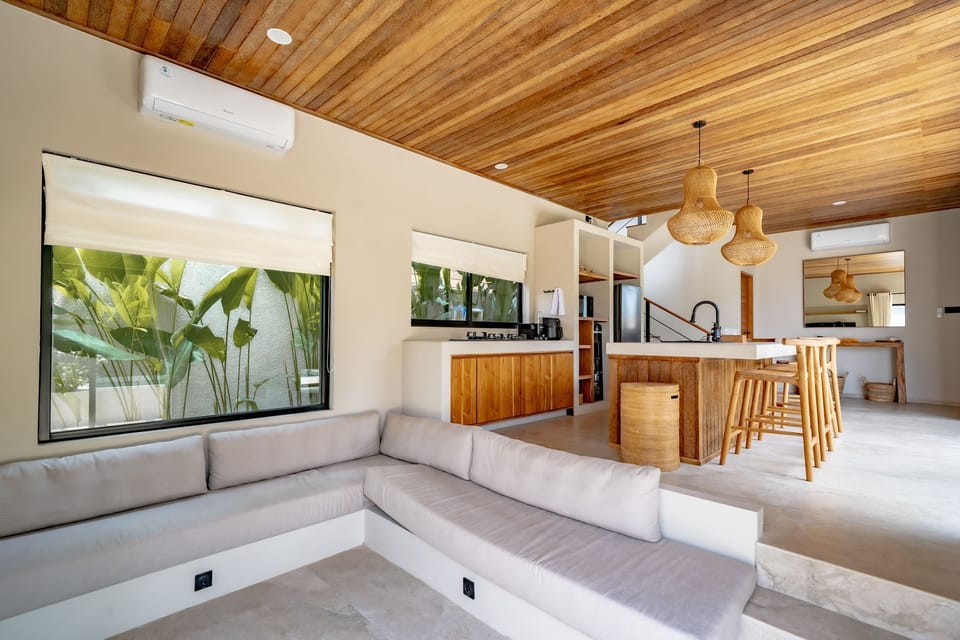 Deluxe Villa, 2 Bedrooms, Patio, Pool View | Living area | 65-inch TV with cable channels