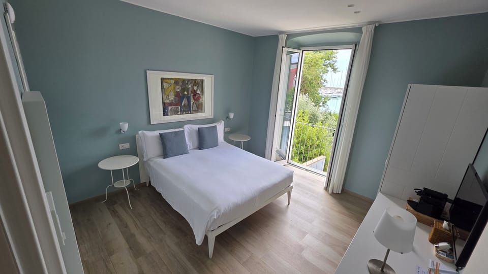 Superior Double Room, Sea View | Down comforters, in-room safe, desk, laptop workspace