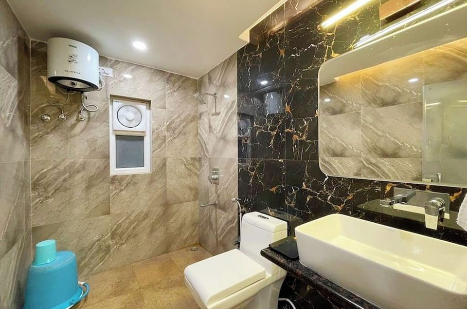 Shower, rainfall showerhead, slippers, towels