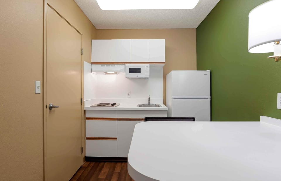 Fridge, microwave, stovetop, coffee/tea maker