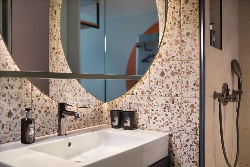 Shower, rainfall showerhead, hair dryer, towels
