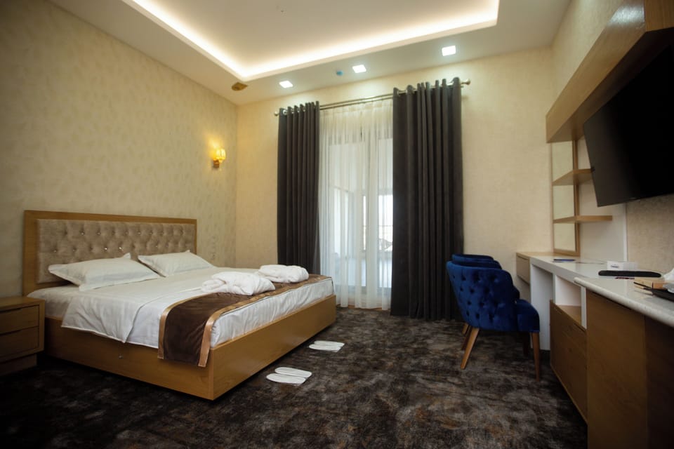 Deluxe Double Room, Balcony, Garden View | In-room safe, desk, laptop workspace, blackout drapes