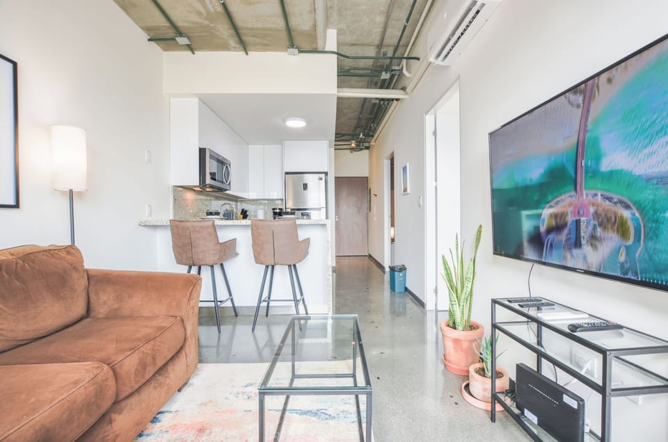 Junior Suite, Balcony, City View | Living area | 55-inch Smart TV with digital channels, streaming services