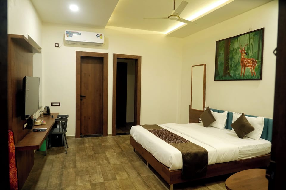 Deluxe Double Room, Balcony, River View | In-room safe, desk, laptop workspace, iron/ironing board