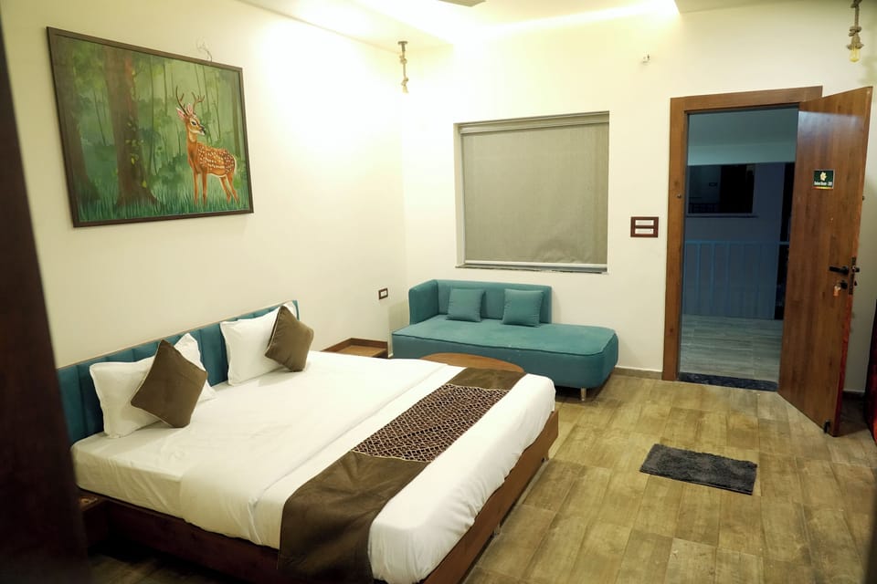 Deluxe Double Room, Balcony, River View | In-room safe, desk, laptop workspace, iron/ironing board