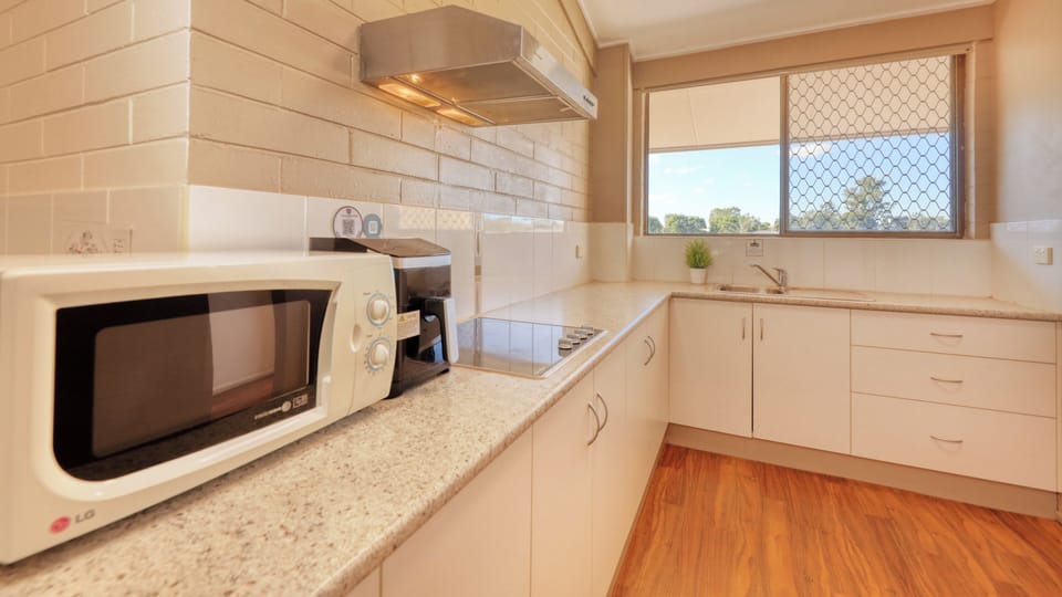 Family Apartment, Garden View | Private kitchen | Fridge, microwave, cookware/dishes/utensils