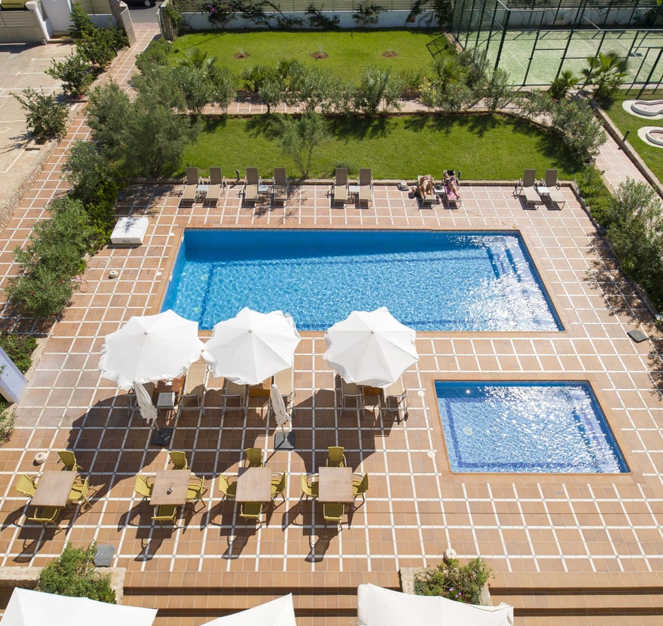 Outdoor pool, open 9:00 AM to 6:00 PM, pool umbrellas, sun loungers