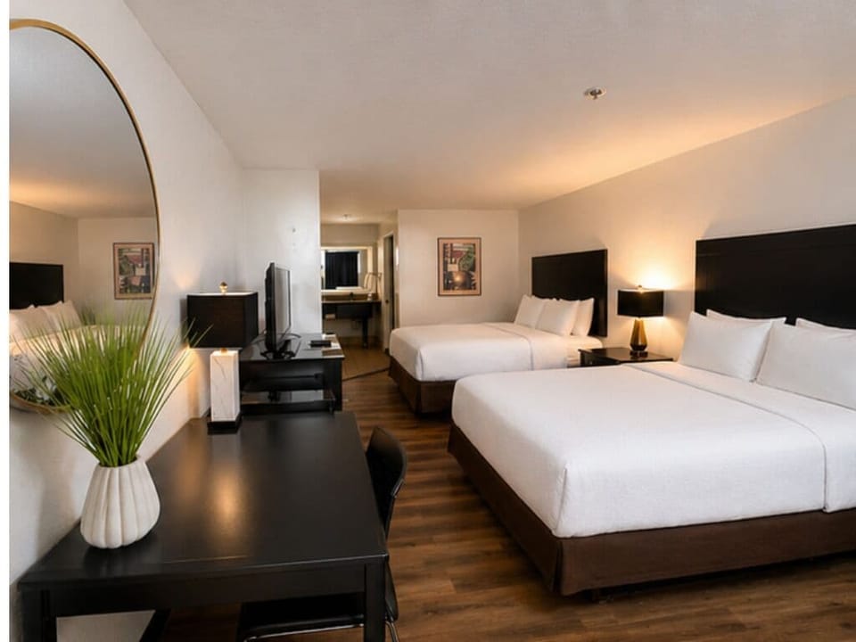 Standard Room, 2 Queen Beds, Pool View | Desk, laptop workspace, blackout drapes, free WiFi