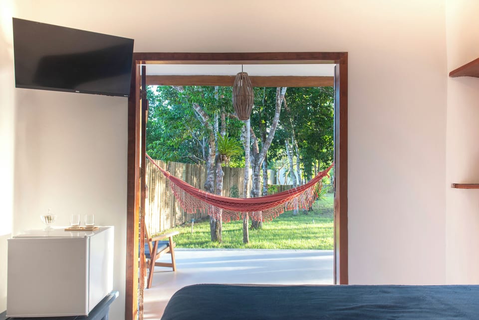 Suite, Garden View | Blackout drapes, iron/ironing board, free WiFi