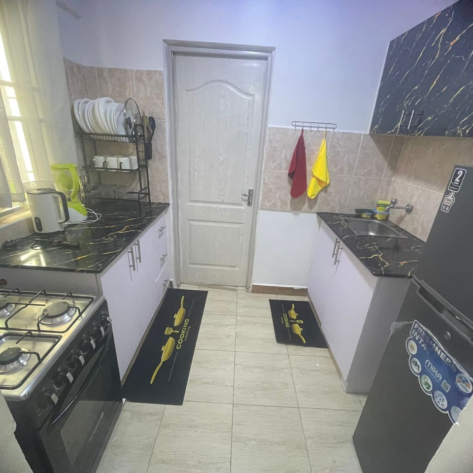 Family Apartment | Private kitchen | Fridge, microwave, cookware/dishes/utensils