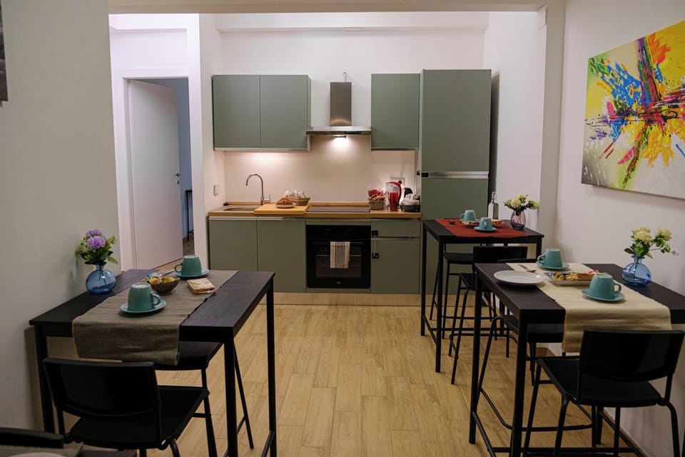 Mini-fridge, oven, stovetop, cookware/dishes/utensils