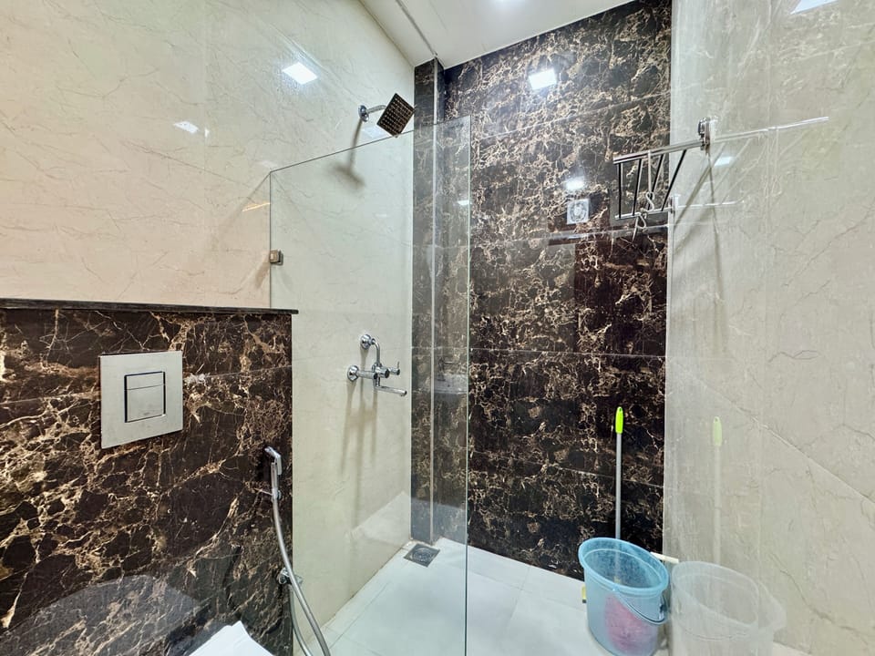 Luxury Room | Bathroom | Rainfall showerhead, eco-friendly toiletries, slippers, towels