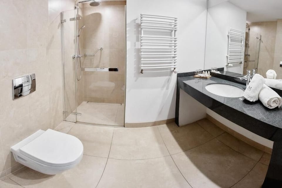 Shower, hair dryer, slippers, towels