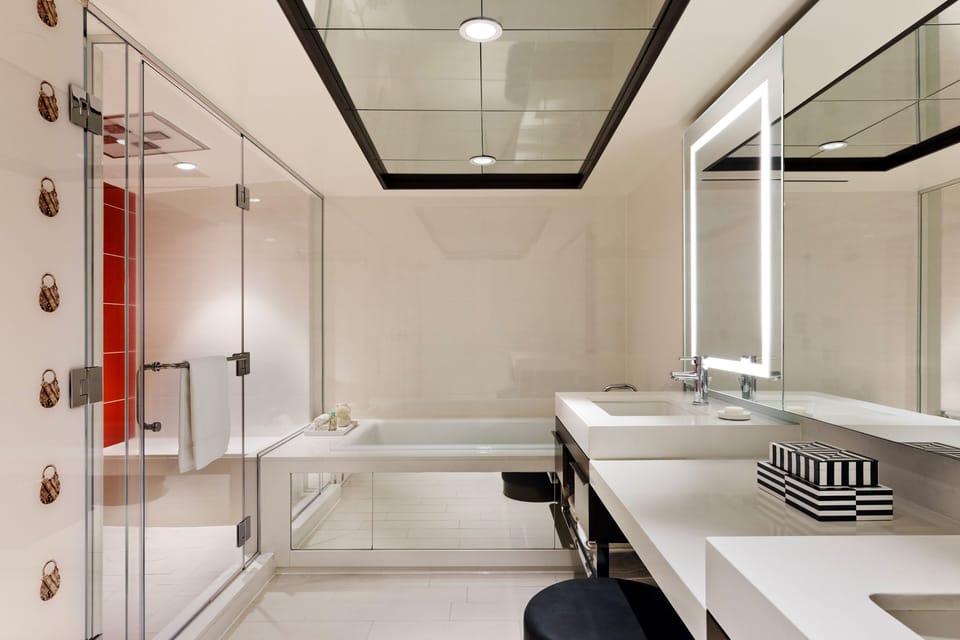 Restore MGM Patio Suite | Bathroom | Eco-friendly toiletries, hair dryer, towels