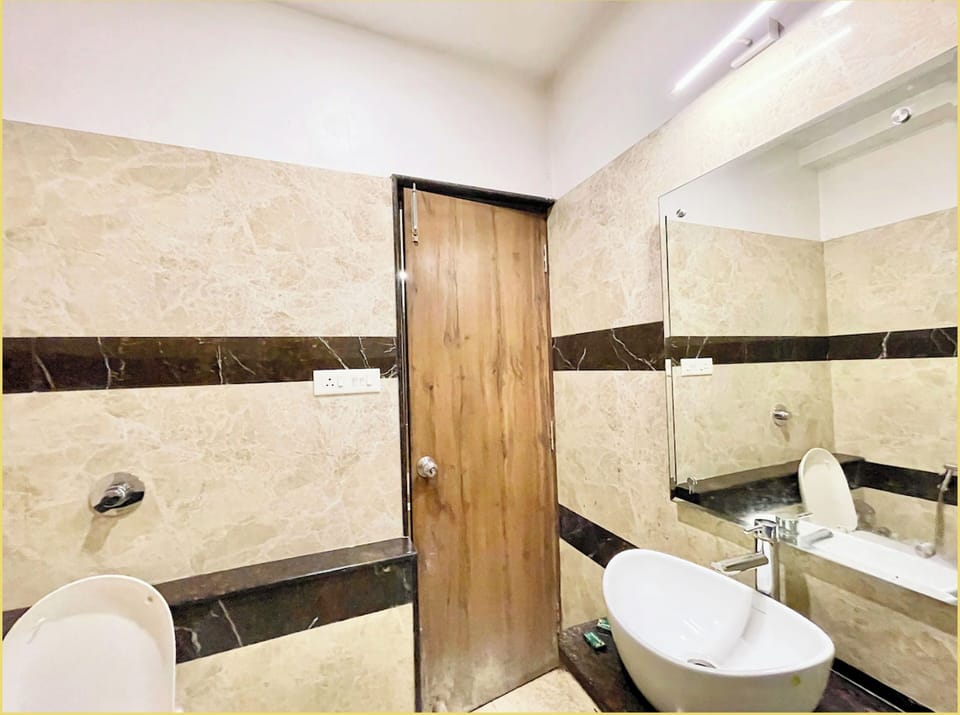 Shower, rainfall showerhead, slippers, towels