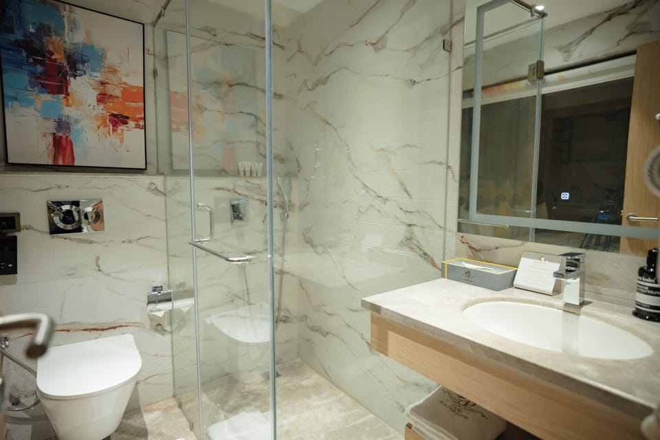 Premier Room, 1 King Bed | Bathroom | Hair dryer, slippers, towels, soap