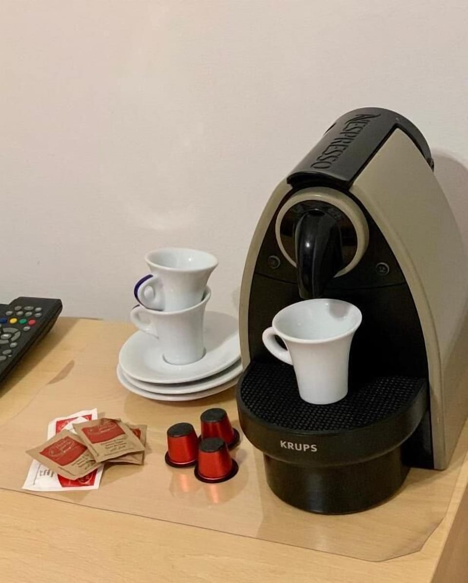 Family Room, Balcony, City View | Coffee and/or coffee maker