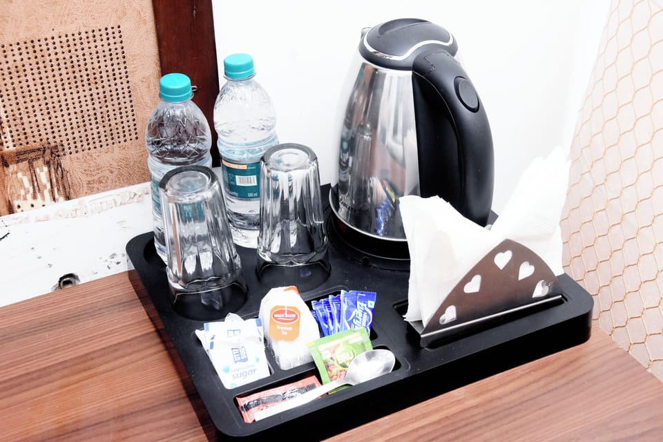 Deluxe Double Room, Balcony, City View | Coffee and/or coffee maker