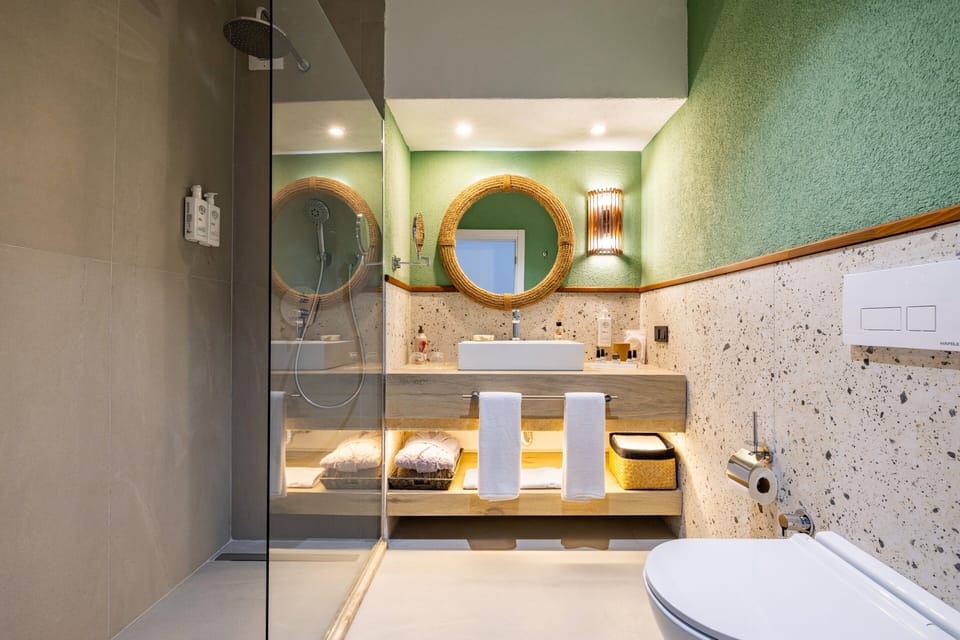 Shower, rainfall showerhead, designer toiletries, hair dryer