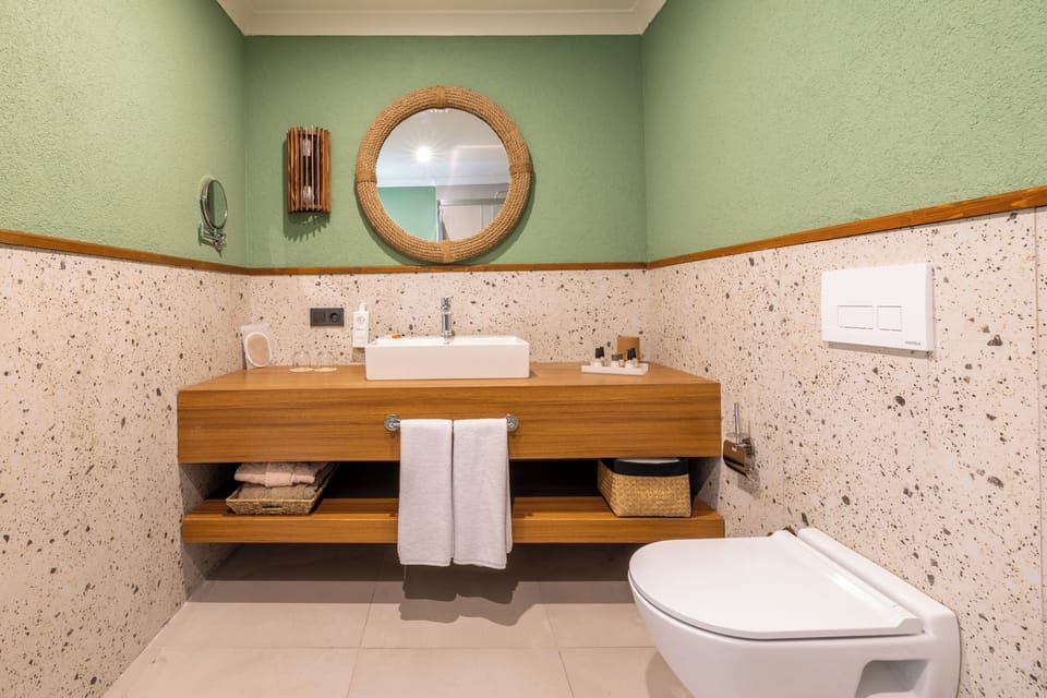 Deluxe Double or Twin Room, Terrace, Beachfront | Bathroom | Shower, rainfall showerhead, designer toiletries, hair dryer
