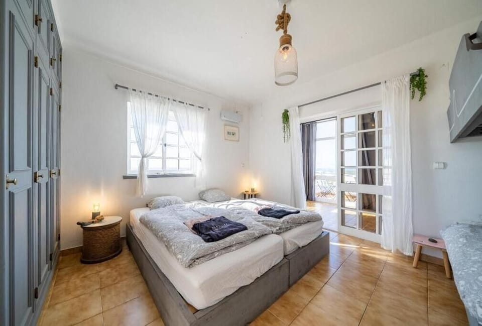 Family Room, Balcony, Ocean View | Free WiFi, bed sheets