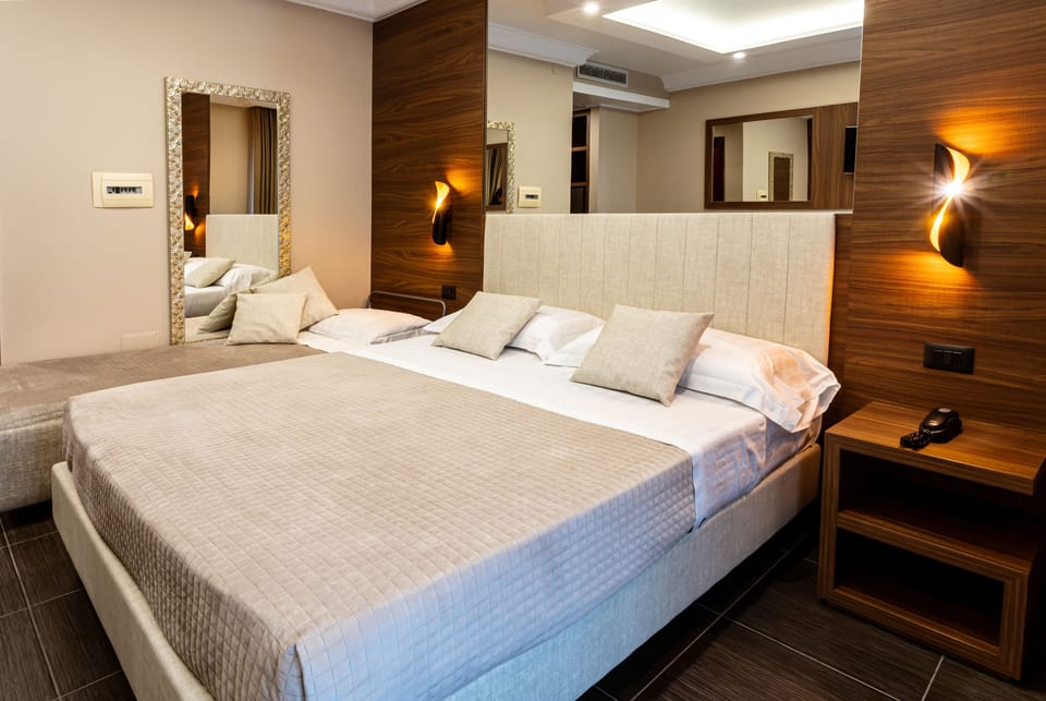 Deluxe Quadruple Room | Premium bedding, minibar, in-room safe, desk