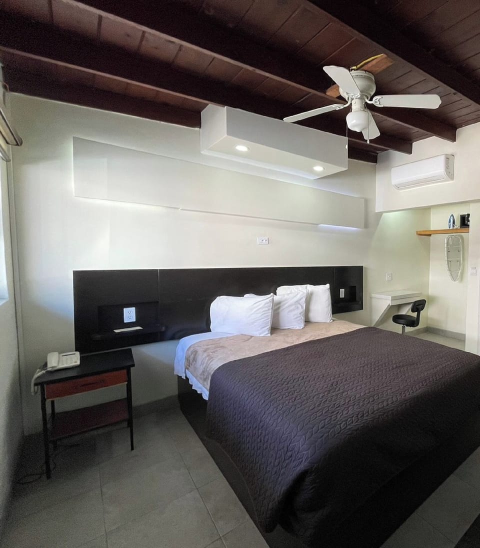 Standard Cabin, 1 Queen Bed | Minibar, in-room safe, iron/ironing board, bed sheets