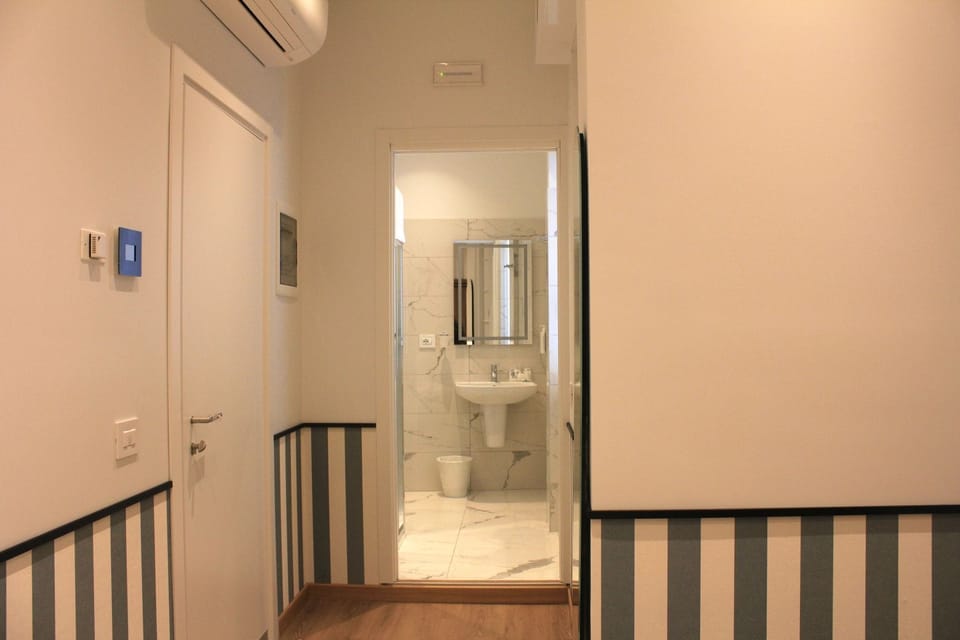 Classic Single Room | Bathroom | Hair dryer, slippers, bidet, towels