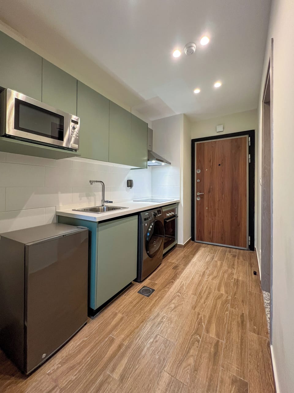 Mini-fridge, cookware/dishes/utensils, cleaning supplies, paper towels