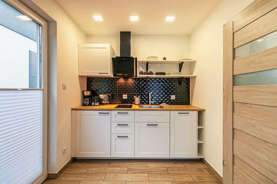 Superior Chalet, Courtyard View | Private kitchen | Full-size fridge, stovetop, dishwasher, cookware/dishes/utensils