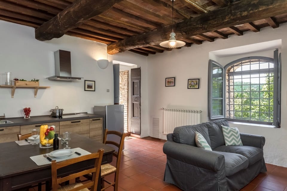 Apartment, Garden View | Living area | Flat-screen TV