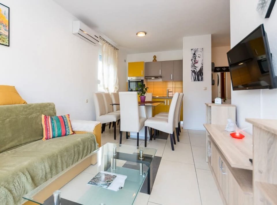 Apartment (Three Bedroom Apartment with Balcony) | Living room | 32-inch flat-screen TV with satellite channels, table tennis