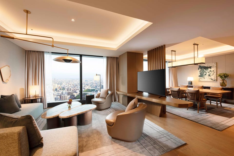 Premium Suite, 1 King Bed, Corner | Living area | 55-inch flat-screen TV with digital channels