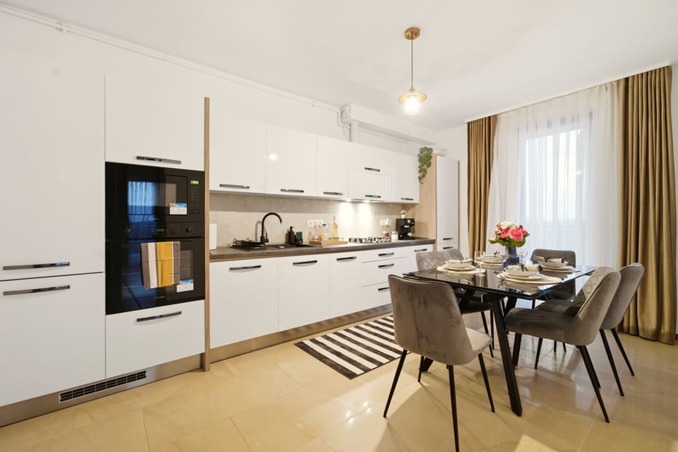 Deluxe Apartment, River View | Private kitchen | Full-size fridge, microwave, cleaning supplies, paper towels