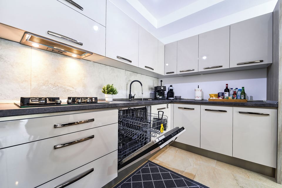 Exclusive Apartment | Private kitchen | Full-size fridge, microwave, oven, stovetop