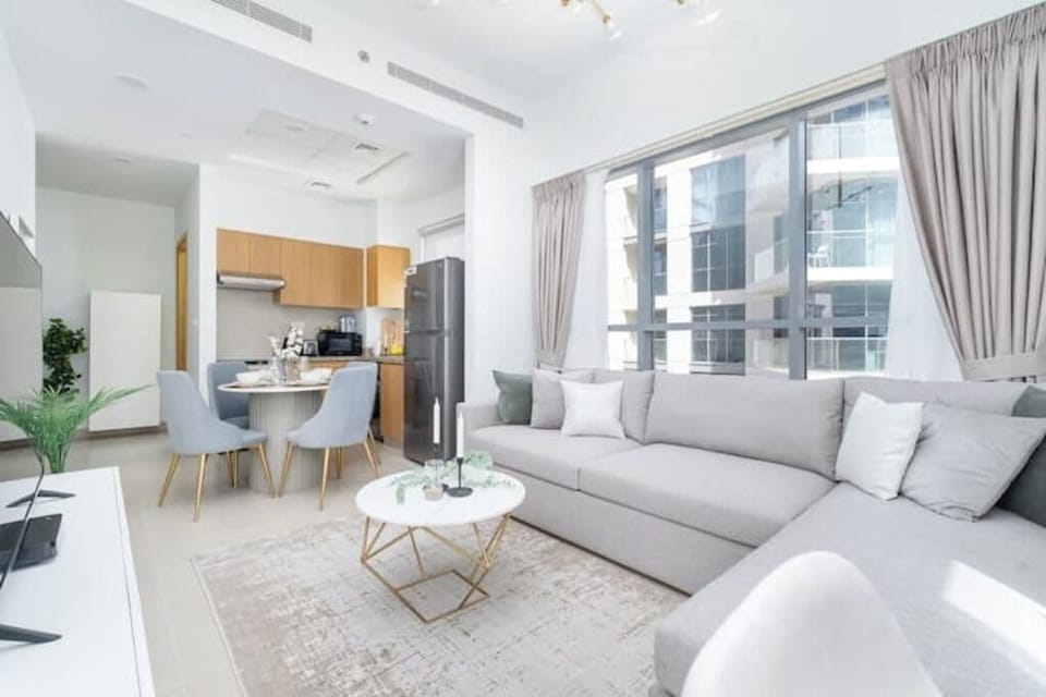 Luxury Apartment, Balcony, City View | Living area | 65-inch Smart TV with cable channels