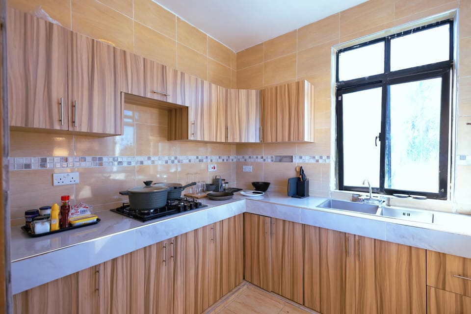 Deluxe Apartment, Balcony, Pool View | Private kitchen | Fridge, microwave, stovetop, cookware/dishes/utensils