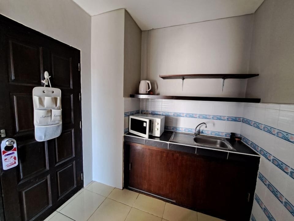 Family Room | Private kitchen | Mini-fridge, dining tables