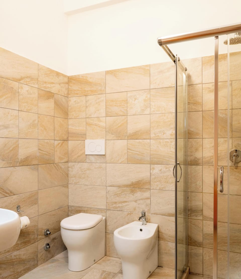 Standard Double or Twin Room | Bathroom | Shower, towels, toilet paper