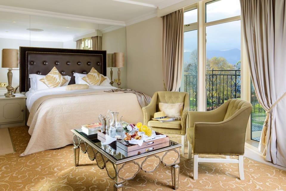 Deluxe Room, 1 King Bed, Garden View | 2 bedrooms, hypo-allergenic bedding, in-room safe, iron/ironing board