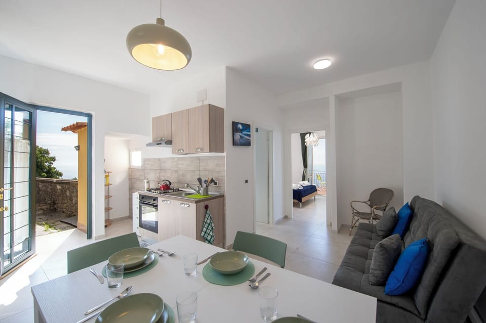 Apartment, Sea View | Private kitchen | Fridge, microwave, oven, stovetop