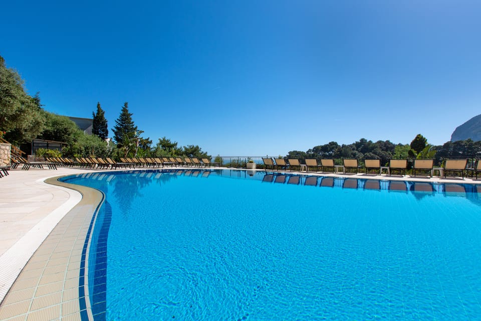 Seasonal outdoor pool, open 10:00 AM to 7:00 PM, pool umbrellas