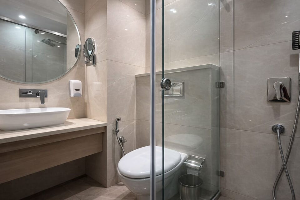 Shower, hair dryer, slippers, towels