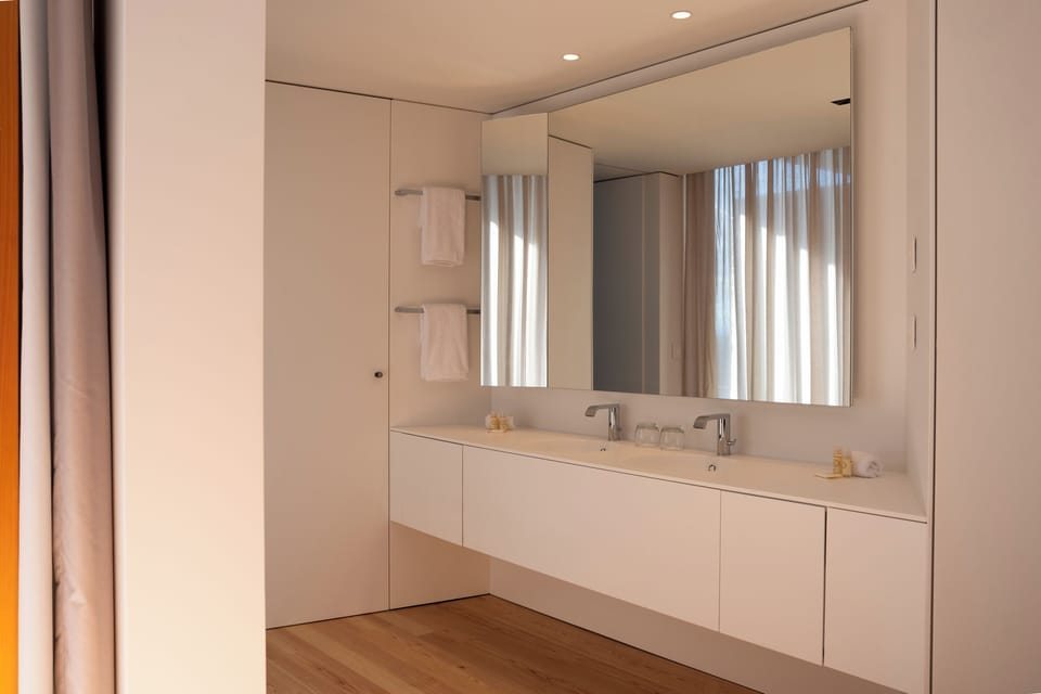 Suite | Bathroom | Hair dryer, slippers, towels, soap