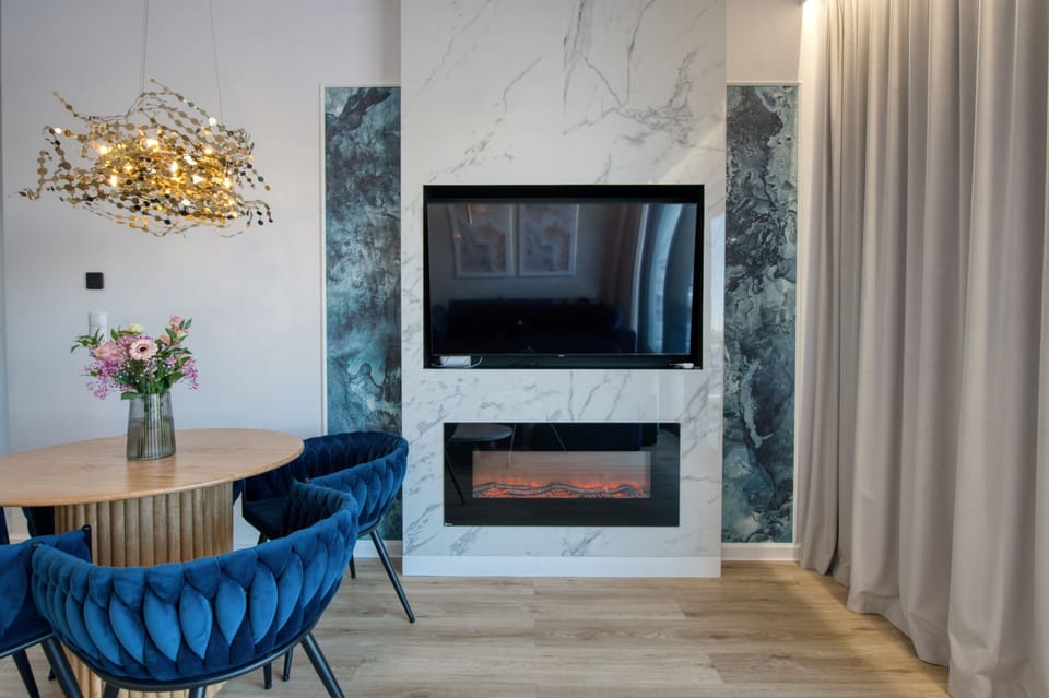 Exclusive Apartment, Marina View | Living area | TV