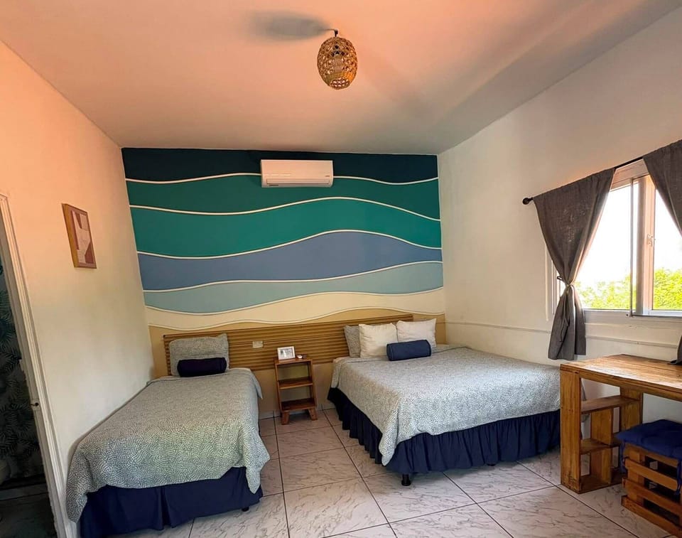 Quadruple Room | Desk, laptop workspace, WiFi (free), bed sheets