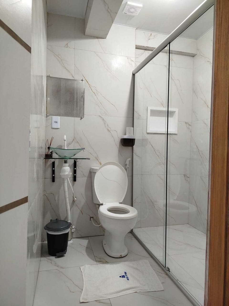 Shower, towels, soap, toilet paper